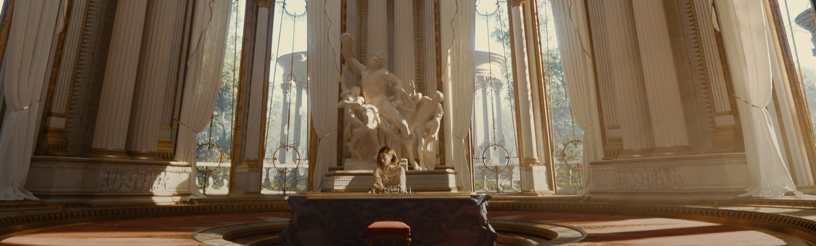 A scene from the Enemies demo, with a woman sitting playing chess in a large ornate room.
