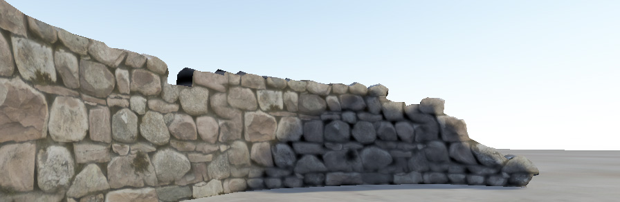 Una pared de piedra sin efecto bumpmap. Las caras y bordes de la piedra no atrapan la luz directional en la escena.
